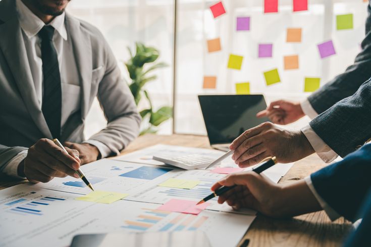 Team reviewing a roadmap and timeline during an advisory session