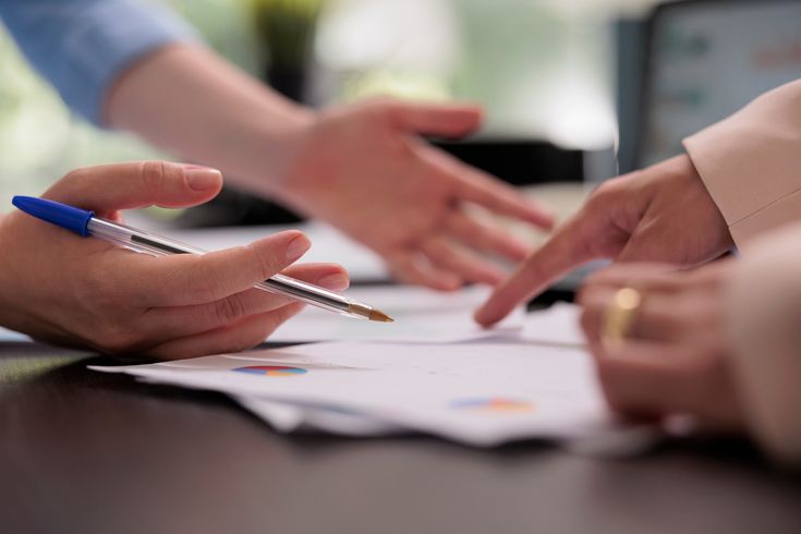 Business advisor facilitating a strategy session with leadership team