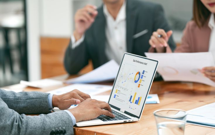 Planning table with written roadmap, calendar and financial notes for the next quarter